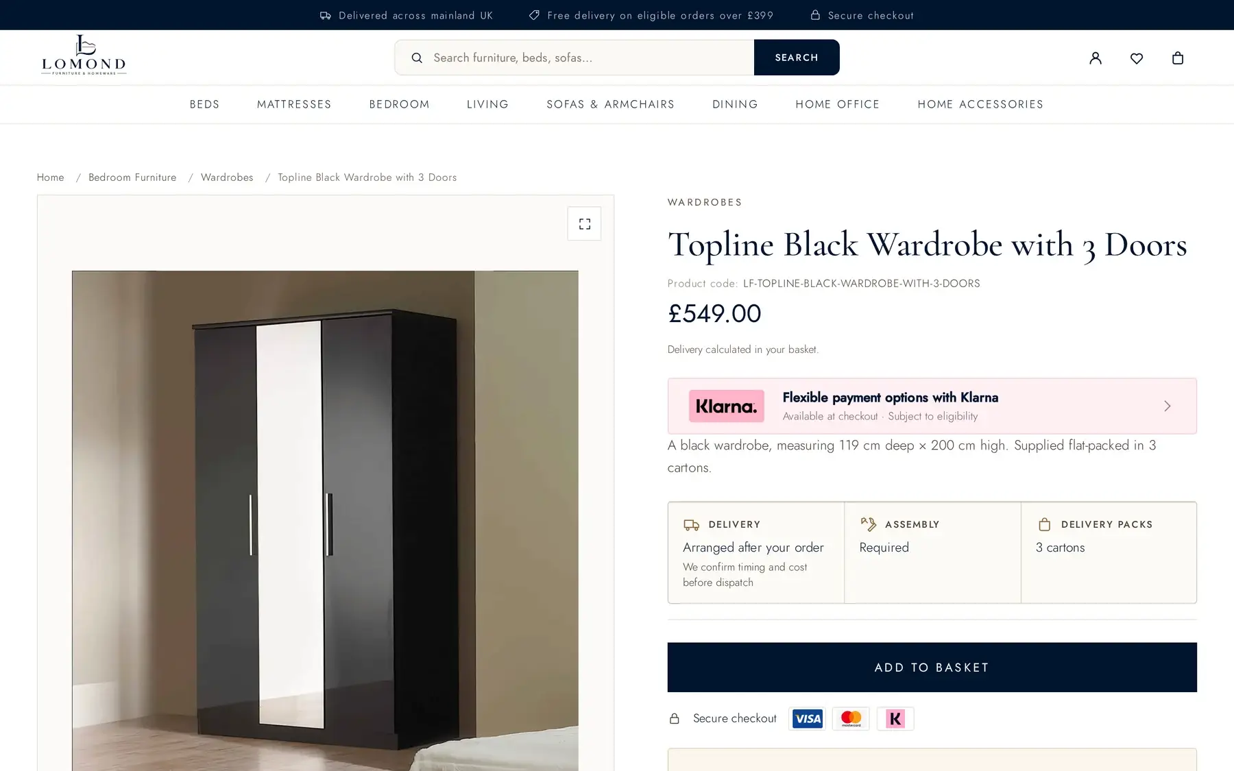 A WooCommerce product page for a black three-door wardrobe on Lomond Furniture, showing the product code, price, flexible payment options, delivery and assembly detail, carton count and an add-to-basket button.